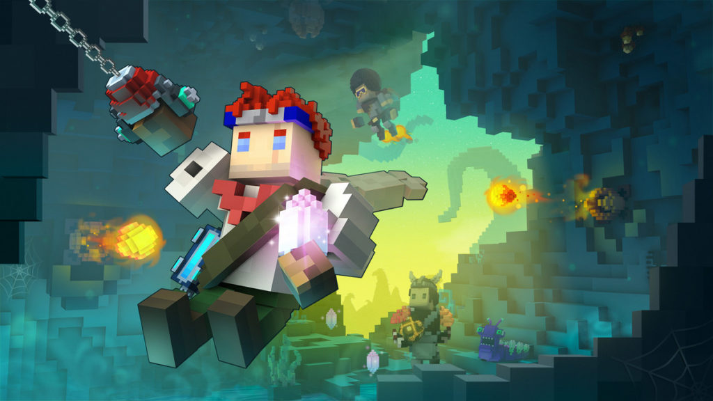 Here we see a screenshot from the game Trove, which shows several characters in 3D-pixel art exploring a dark, blue shimmering cave. In the foreground, a playable character with red hair, a blue headband, and a blue shoulder bag can be seen in a long shot as he is about to leap forward through the cave toward the viewer with a grappling hook. In the background, another character wearing a helmet with horns stands on the ground, and above him, a figure with a black afro flies through the cave. Two fireballs are ejected from the left and right, flying in the direction of the players. In the distance, we see the open game world in yellow-turquoise light.