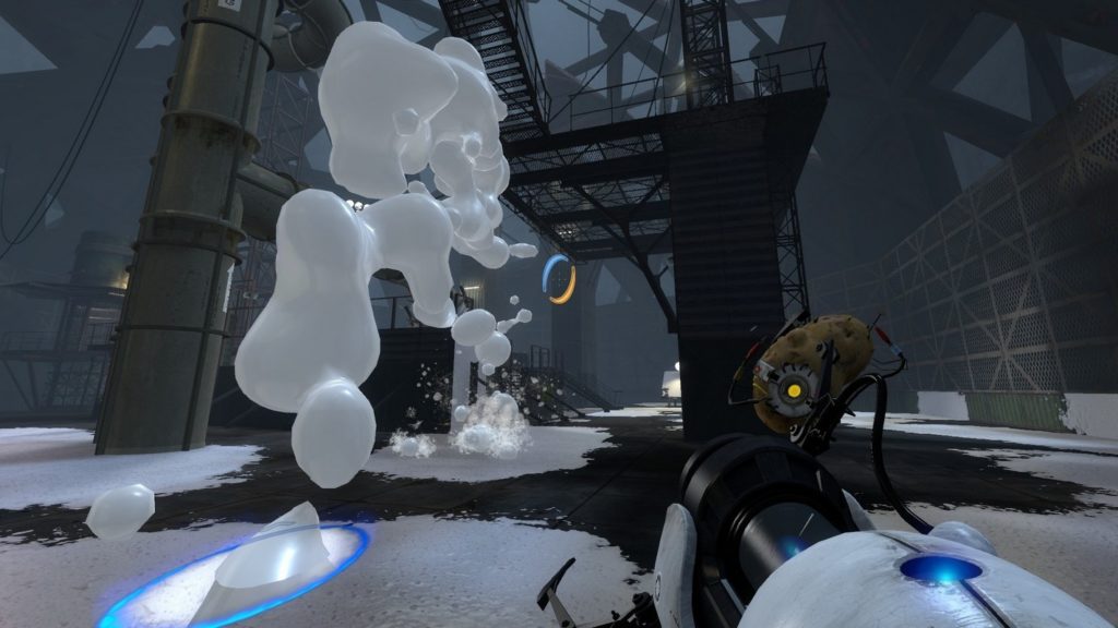In this picture, we see the player in the first-person perspective with his teleporter gun standing in a kind of warehouse. In front of him is a large metal framework with a staircase. The floor is partially covered with a snow-like substance and a white, viscous mass is falling from the center of the image into a blue portal placed on the floor in the foreground. The scene is very dark and there is a light mist in the air. Play Portal 2 as one of the games like It Takes Two with a friend.