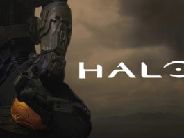 You can see the cover of the new Paramount+ TV series "Halo". On it, you can see a UNSC Spartan on the left side of the image, with his distinctive helmet protruding into the frame. On the right side, the title of the series "Halo" can be seen in white letters. In the background, dense brown dust covers the image. Halo season 2 for Paramount+ went into production.
