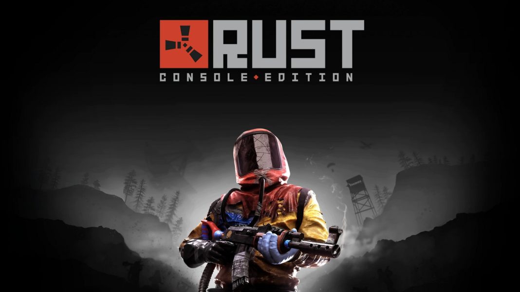 In this picture, we can see the cover of the game Rust, which can be considered one of the best survival games for PS4 and PS5. The cover shows a game character in a red and yellow combat outfit including a full helmet in the lower half of the picture, holding a rifle in his hand and looking at the viewer. He stands in front of a black-and-white background, in which the landscape and parts of buildings can be seen. Above the figure is the logo and the title of the game 