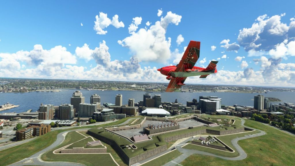 A red plane flies around the Halifax, a place of interest of Canada, which can now be admired thanks to the World Update 11.
