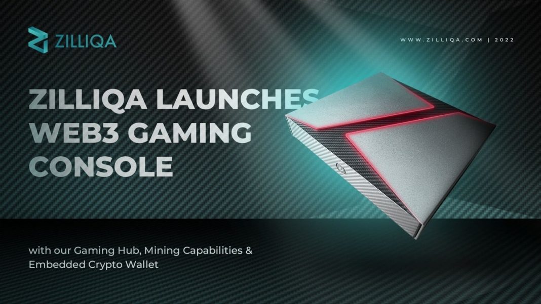 The Web 3.0-based Zilliqa Gaming Console can be seen on the right side of the picture in a long shot in a slightly slanted perspective from above in a metallic gray case. On the upper side, the case is designed in such a way that a black 