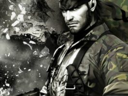 Here we see the protagonist of the new Metal Gear Solid Remaster, Solid Snake, in close-up. He is standing sideways to the viewer. He wears a light beard, military clothes and looks at us seriously and full of willpower. In the background we can see some flying debris behind him on the left side, and a camouflage pattern on the right. The image is in black and white from left to center and becomes colorful to the right.