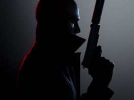 You can see a cover image from the game Hitman 3, which is one of the best stealth games. It shows the protagonist Agent 47 in a coat with a turned-up, high collar and a shaved head in profile with a pistol with a silencer held high. The image is very much in black and white and the face appears almost as a black silhouette. However, his face is impressively illuminated with white light from diagonally behind on the right, which brings out his face in an interesting way and also creates an impressive white outline on the pistol. On his back, on the other hand, a blood-red contour stands out, created by a red light coming from the left side.