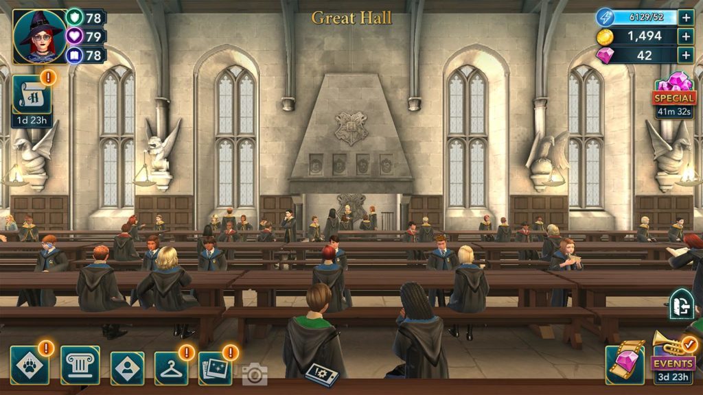 In this screenshot of the Harry Potter mobile game Hogwarts Mystery, we see the dining room, with many young wizard apprentices at the many wooden tables. At the edges of the image we can see the user interface elements of the game.