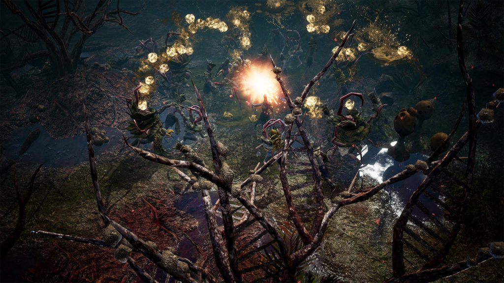From an isometric perspective, we see the player centered in a gameplay scene of Undecember, another Diablo clone, fighting many enemies with a spell. The player is in the middle of a swampland with dead trees and blood-red ground in places. He is creating an orange-red fireball in front of him, which damages the enemies around him and yellowish fiery shapes appear above their heads. In the foreground, a huge dead tree looms into view, which also obscures the frame a bit.