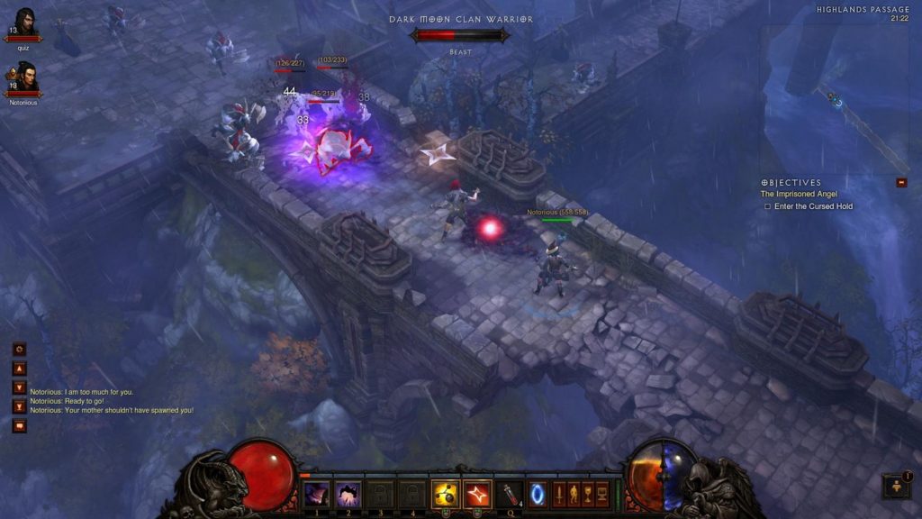 Take a look at Diablo 3. Blizzard's hack-and-slash title is great to play with friends on the PlayStation 5. Here we see a screenshot from the game, which shows two players in a top-down view in a long shot in the center of the image, standing on a stone bridge and fighting against a group of beasts. The bridge runs diagonally through the image from the bottom right to the top left. The fight takes place at the top left end of the bridge, where a beast is about to be cast with a red spell, killing it. To the left and right of the bridge is a deep stone abyss. The scene is kept very foggy bluish and dark.