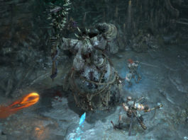 Play with familiar classes in Diablo IV and fight impressive boss battles, as seen in this screenshot: We look down on the action from above in an isometric perspective. In a dark, cold stalactite cave, there is a huge slimy pale creature in the center of the image. It holds a large spiky club in its right hand and looks straight up at the cave ceiling. To its right, two players stand around the creature, shown in total view. The player in the upper right is a female character with long red hair, armor, and a sword with which she is about to strike. Further down, the other player stands as a muscular barbarian who is also striking at the beast with two axes. From the left, a fireball and an icicle fly at the creature in the middle. A Diablo 4 release date is already possible in April 2023.