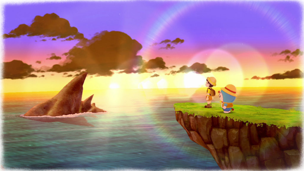 In this screenshot, we see two of the many Doraemon characters enjoying a sunset. The two are shown in a long shot in profile on the right side of the image. They are standing on a grass-covered rocky outcrop, looking to the left at the sea shone on by the evening sun. On the horizon, on the left side of the image, you can see the setting sun, which causes beautiful lens flares in the foreground. The sky gets a yellow-magenta-purple gradient and the clouds appear warm-brown. The sea is turquoise and on the left side, a bit in the background, a pointed brown mountain rises out of the water. But there is much more to discover in the new part of Story of Seasons.