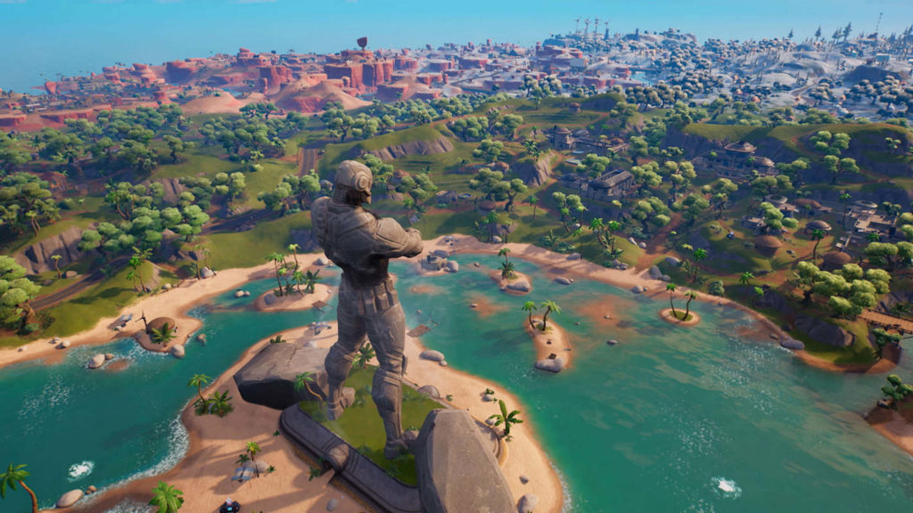 We are looking at a screenshot from Fortnite Chapter 3 Season 1: Flipped. In the picture, we see the new island, with a desert and a snowy landscape to discover. In the foreground, a mighty stone statue rises into the air. It has yet to be discovered when Fortnite Chapter 4 will be released.