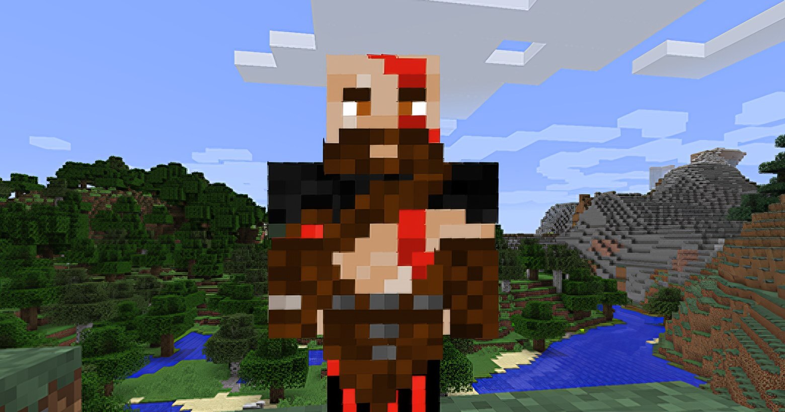 Use the God of War skin for Minecraft and gain respect in the pixel world. In this screenshot, you can see Kratos, the protagonist of the game "God of War Ragnarok", in pixel form in front of the typical world of Minecraft. He is shown in the center of the image in the half-total view in the foreground facing us and wears brown and red fur clothing. He has a shaved head with red war paint on it. In the background, we glimpse numerous pixelated hills. On the left side, a large section of forest is depicted running over a widely stretching hill, and on the right, a brown-earth and stone hill landscape is depicted. In the center is a valley with a blue lake meandering along it. The blue sky with numerous square clouds occupies the upper half of the picture.