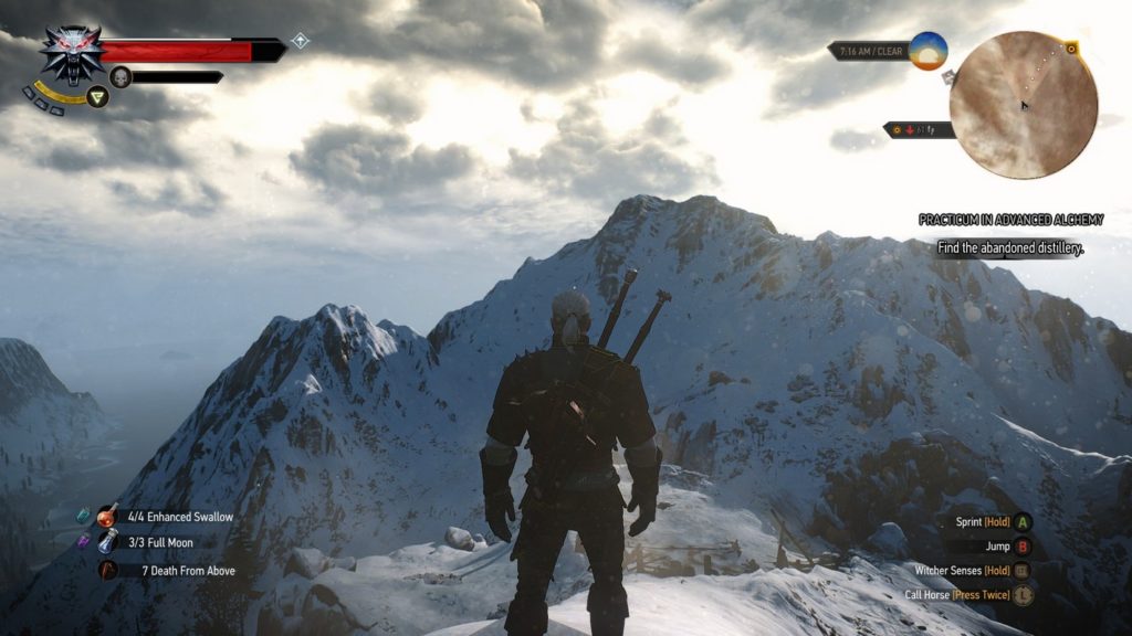 In the center of the frame, the protagonist is seen in the third person in half-total in daylight. He is standing on a snow-covered mountain and looks at another snow-covered mountain range in front of him in the distance, which takes up most of the frame horizontally. Above it, we glimpse a very bright sky with lots of clouds. A red life bar is shown in the top left corner, and a circular minimap is shown in the top right corner. In the lower right corner, we see interaction aids for the player in a vertical arrangement, and in the lower left corner, we see items displayed, also in a vertical arrangement. The new Witcher game may also be set in the mountains again.