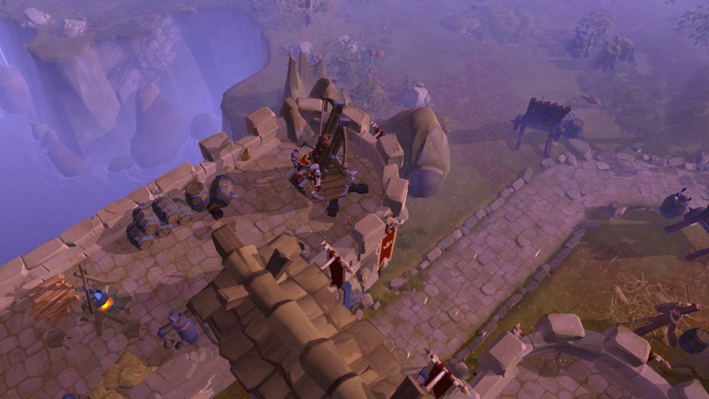 Albion Online is one of the best sandbox games and a free-to-play game where you have a lot of creative freedom. In this screenshot, we can see a constructed castle from above, with a stone path leading out of it to the right. A misty canyon can be seen at the top and some trees and grassy ground are shown at the top right.