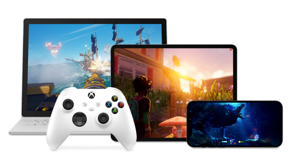 Here we see a white Xbox controller against a white background on the left side at the bottom of the image in a long shot. It is shown in front of a laptop, a tablet, and a smartphone. The three devices are staggered in front of each other. We see the laptop at the very back left of the image, on which a cannon duel is currently taking place on the high seas in first-person perspective. In front of the laptop, in the center of the image, is a black tablet on which a third-person game is displayed in orange. Right in front of it is a black smartphone turned horizontally by 90 degrees showing a blue underwater game. These three games are playable on various devices thanks to the Xbox Cloud.