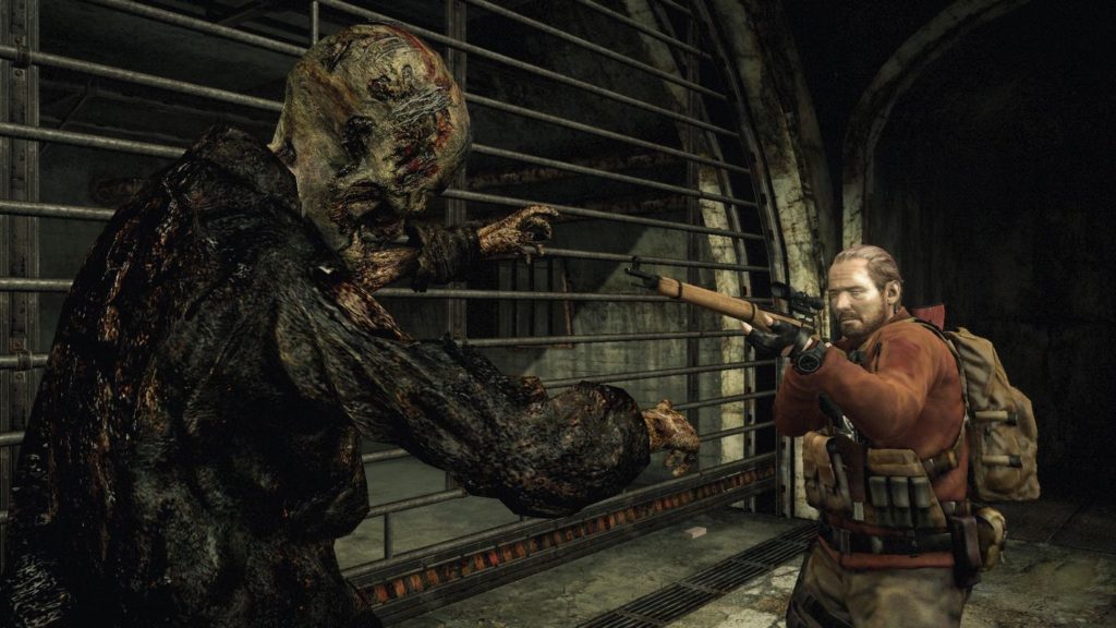 In Resident Evil: Revelations 2, one of the highly recommended co-op horror games, you fight again with different weapons against the undead, as shown in this screenshot: Barry, one of the playable characters, can be seen in half-profile in semi-total view in the bottom right of the image. He is wearing a red jacket equipped with numerous brown pockets and wears brown pants. His brown hair is combed back. He is aiming through a brown sniper rifle at the head of an approaching decomposed zombie, which can be seen in the foreground on the left. The character is in some sort of dark sewer. In the background is a huge grate with metal bars running horizontally, behind which is another room. This installment in particular is one of the very good scary games to play with friends.