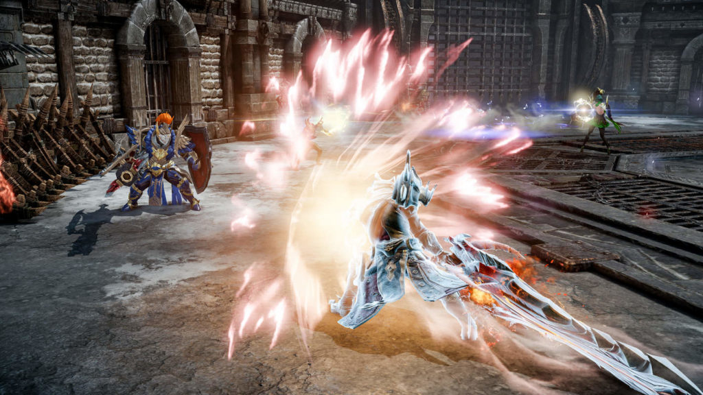 Prove yourself in PvP combat and earn valuable XP and rewards, as shown in this screenshot: We are looking at a playable character from behind, who can be seen in the frame centered in the lower half of the image in long shot. He wears an iron, highly reflective armor, and an equally iron helmet. He is about to strike a horizontal blow with a huge, jagged iron sword, causing many bright red blades to open up in front of him to form a kind of shield. In the upper left background are a battle-ready enemy knight in blue armor and a large red shield, which the player is about to attack. The scene takes place in a large stone circular battle arena, which is also good for leveling. We can see the stone walls of the arena in the upper half of the picture. At the top right of the image, another green-colored character is shooting at the knight in blue armor.