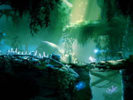 As the forest spirit Ori, you explore a breathtakingly beautiful forest in one of the best Metroidvania games on Nintendo Switch, which, however, also carries dark dangers, as illustrated in this screenshot: The protagonist Ori, a white cute creature, can be seen on the right side of the bottom screen in long shot, as he runs over a rotten tree stump to the left. We look at the action from the side, so the world is presented as a 2.5 D sidescroller. Above the protagonist, we see a blue shimmering round creature, which accompanies him. The playable foreground level, on which Ori walks, runs horizontally through the bottom half of the image and consists of rocks covered with grass and leaves. A wooden fence running horizontally is shown on the left side of the rock. The foreground is very dark and forms a great contrast to the background, which consists of more overgrown plains and hanging plants that are illuminated by the sun. Overall, the image appears very greenish with isolated blue accents scattered throughout the image.