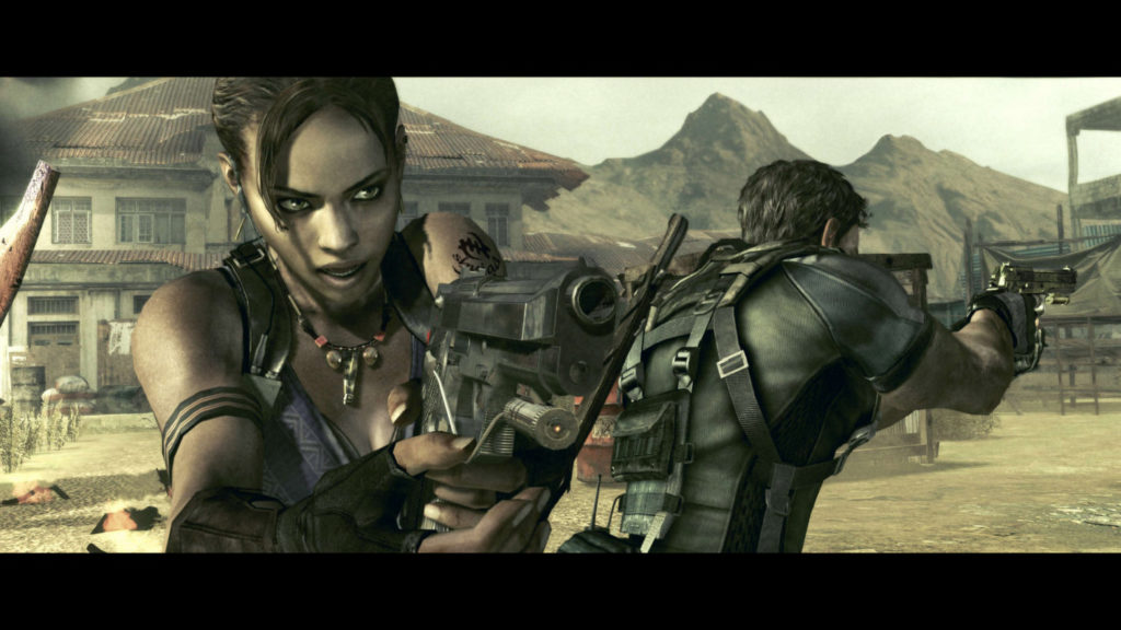 With Resident Evil 5 you have found one of the highly recommended co-op horror games. This screenshot shows a cinematic from the game. The two main characters can be seen here in the medium close-up in the center of the picture, looking in different directions with drawn weapons. They are in a very sandy market place during the day. The female character has black hair tied back, has a southern taint and wears a purple top. The male character to her right wears a dark green combat uniform with numerous straps. In the background is a house with a red roof and behind it a sandy mountain range.