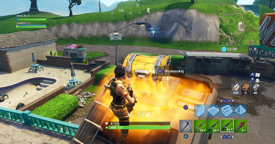 With Fortnite tips, you will learn how to behave correctly after the jump. In this screenshot, we see the player as a female character in the third person in a long shot with a brown braid, dark brown top, and orange combat pants. She is centered at the bottom of the screen and is jumping onto a roof, where she opens a golden chest with excellent loot, which is located in the center of the screen. The player is playing a map during the day and around him, there are urban structures like brown and turquoise house facades as well as a rural environment with hills on which green grass grows along with trees. The urban environment is in the image's foreground, whereas the countryside opens up in the background. Learn in a suitable guide, how to get better at Fortnite and use the best settings.