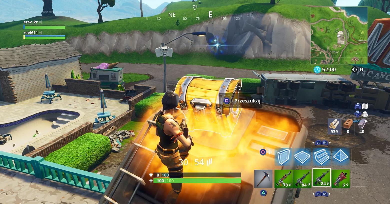 With Fortnite tips, you will learn how to behave correctly after the jump. In this screenshot, we see the player as a female character in the third person in a long shot with a brown braid, dark brown top, and orange combat pants. She is centered at the bottom of the screen and is jumping onto a roof, where she opens a golden chest with excellent loot, which is located in the center of the screen. The player is playing a map during the day and around him, there are urban structures like brown and turquoise house facades as well as a rural environment with hills on which green grass grows along with trees. The urban environment is in the image's foreground, whereas the countryside opens up in the background. Learn in a suitable guide, how to get better at Fortnite and use the best settings.
