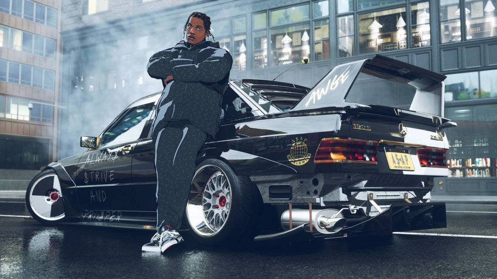 This screenshot from Need for Speed Unbound proves that PS5 racing games can also have a special graphic style: In a slight bottom view, we look at a black man who can be seen in long shot during the day. He looks over us in our direction and has his arms crossed while he casually leans against a black race car. The man has black dreadlocks and a blue and gray tracksuit on. The car is seen in profile, pointing to the left. In the background there are skyscraper facades with many windows and the urban environment is reflected in the car body. All the pictorial elements depicted have a rather comic style.