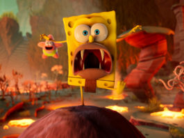 In this screenshot of Spongebob Cosmic Shake, we see the yellow SpongeBob in the center of the image in the long shot from the front. With his right leg, he is balancing on a rolling earthy ball, which is coming towards us and can be seen at the bottom of the screen. The protagonist has a panicked look and a wide open mouth, in which we can see four sharp teeth. In the background, a bit to the left of the image is a flying Balloon-Patrick in pink paint and greenish shorts smiling as he flies after SpongeBob. The two are in a fanciful wish world consisting of numerous weird plants, earthy platforms, and lava areas, which we glimpse to the sides and in the background in the blur. The scene is very red-lit by the lava. The title has a release date and the screenshot already gives a good insight into the gameplay that awaits you.