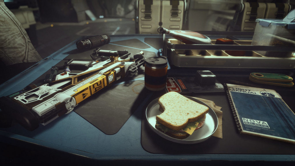 We sit in a spaceship at a table and look in first-person perspective at a sandwich in front of us. Diagonally above we see a kind of coffee container. To the left is a black and yellow assault rifle. To our right on the table, we see a blue collage block with the inscription "Flight Manual - Nova Gakactic in blue capital letters in a modern layout. Above it is a kind of metal container with several compartments for various foods. In the background, we catch a blurry glimpse of the rest of the spaceship.