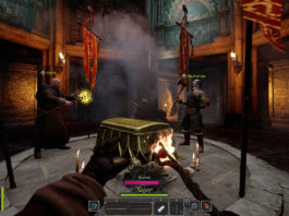 In this screenshot, the player is in first-person perspective in a dark square basement room. He is standing in front of a round stone pedestal with a golden chest in the center. To the left and right of the chest are two other players on the team. The left player is a Cleric with a brown robe and a kind of long scepter, the upper end of which glows golden. The right player is a Barbarian in brown leather armor, a full iron helmet, and a large axe in his right hand. The player in first-person perspective just extends his left hand and we see that he is wearing brown cloth clothing and black gloves, which we can see at the bottom of the image. In his right hand, he holds a wooden wand with a burning ball on the end facing forward. There are burning candles around the chest. The room goes up very steeply and consists of stone facades and turquoise textures. Red banners hang down from the walls at regular intervals. Get to know the game better with helpful Dark and Darker tips and choose the classes that suit you best. A release date is not yet known.