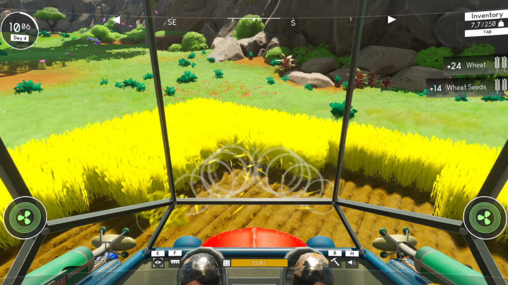 As the player, we are in the cockpit of a mech during the day, looking out through the glass pane in first-person at a field of wheat in front of us, which we are currently cultivating. With the help of our mech arms, we harvest the wheat, which can be seen in dense yellow clumps on a brown-speckled field. The field extends into the middle ground of the image. Behind it, we see a grassy landscape that leads to a rocky mountain range, which we can see in the background in the crop at the top of the image.