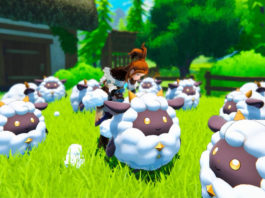 In this screenshot from Palworld, we are standing on a lush green grassy field in broad daylight. Numerous spherical very cute-looking sheep with yellow beady eyes and smiling faces are standing in the field around us. The field extends into the background of the image, becoming increasingly blurred. The focus is on a female character with a brown pigtail and brown and white clothing. The player is shown in a long shot in the center of the image. He is bending down to a sheep in order to gain wool. Around the field, we glimpse a forest landscape with lush green leaves as well. In the upper left of the image in the background, a half-timbered house with a brown roof and white exterior is shown in the blur. A release date has yet to be announced, but a trailer already shows a lot of gameplay.