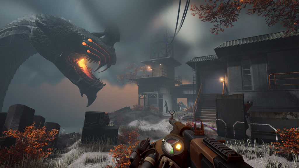 The player is standing on a kind of rocky plateau. To the right is a building and to the left is the head of a giant fire-breathing dragon creature.