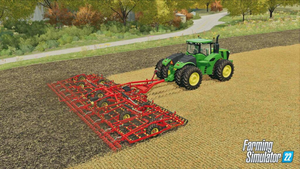 A green tractor is seen on a yellow field, harvesting with a red trailer. Farming Simulator 22 has many valuable mods.