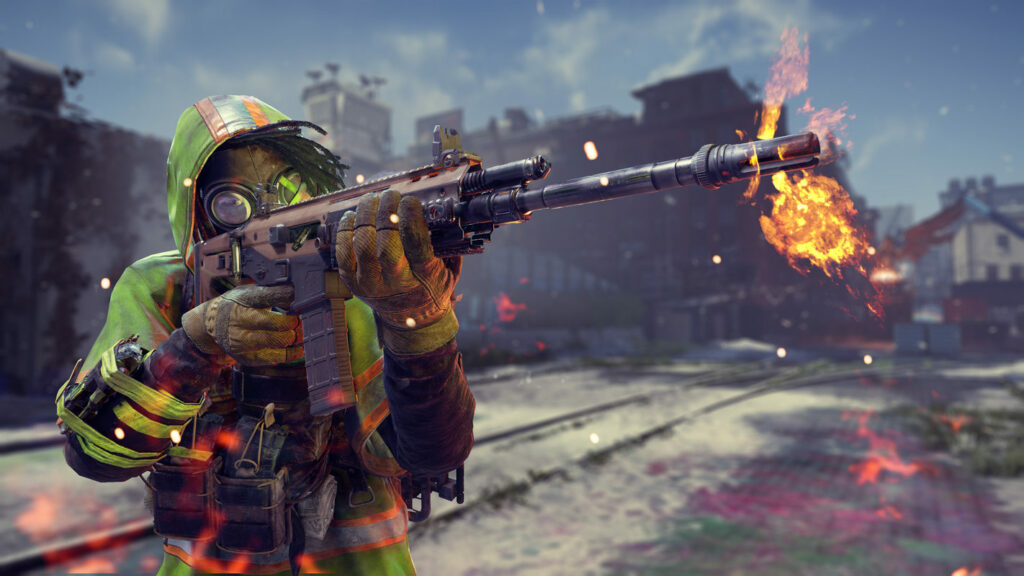 We see a player with a gas mask and a yellow jacket in XDefiant shooting with a rifle. The game has high-speed gameplay.
