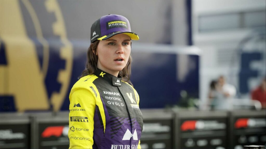 In the close-up, we catch sight of a brown-haired female racer in a yellow and purple outfit with a cappy in F1 23.