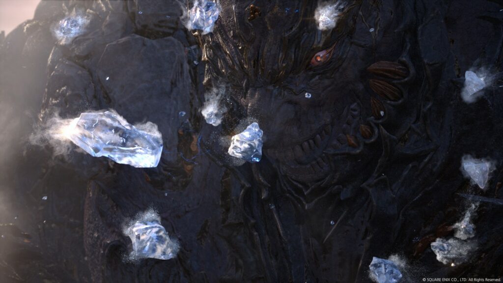 A dark giant creature is seen in close-up looking grimly at flying crystals in Final Fantasy 16.