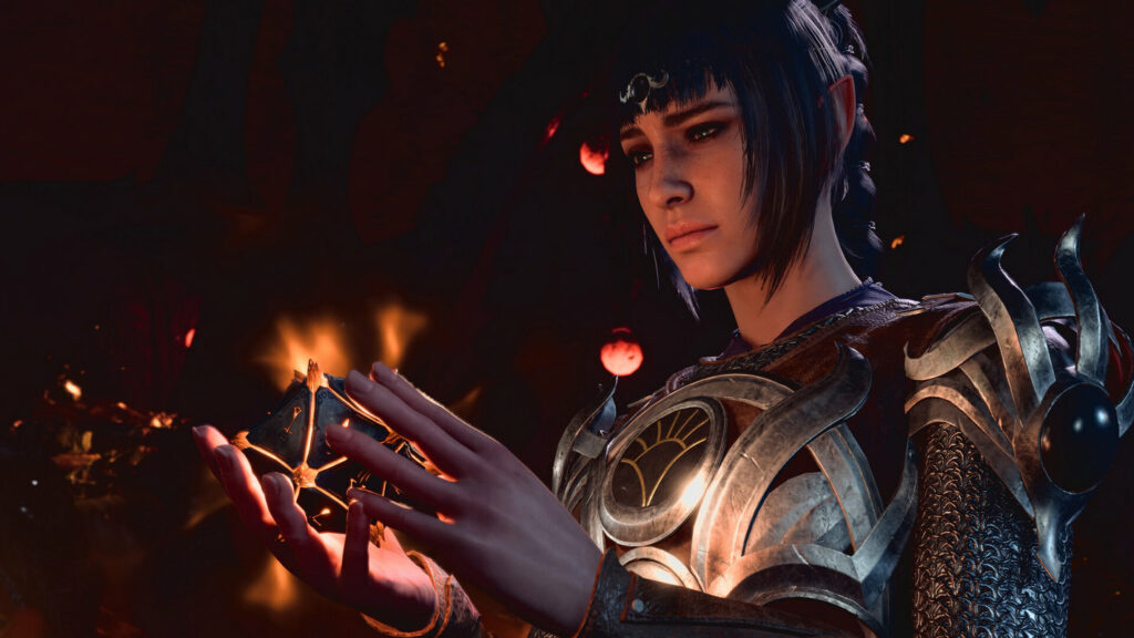 We see a female human character in the dark in a close-up, creating a red glowing orb with both hands and looking at it.