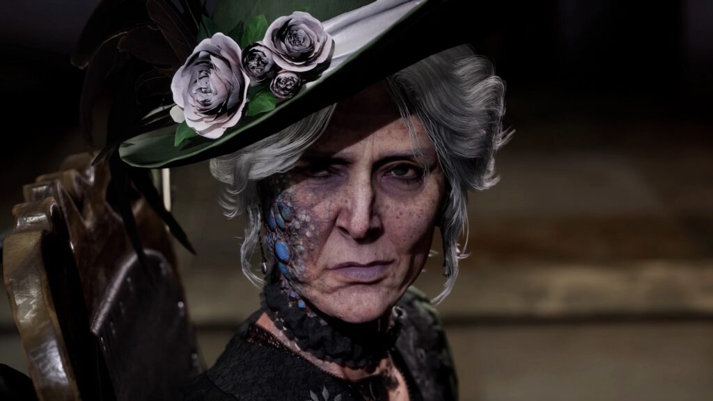 A close-up of Antonia can be seen. She wears a green hat in Lies of P, has gray hair pinned up, and a blue rash on her face.