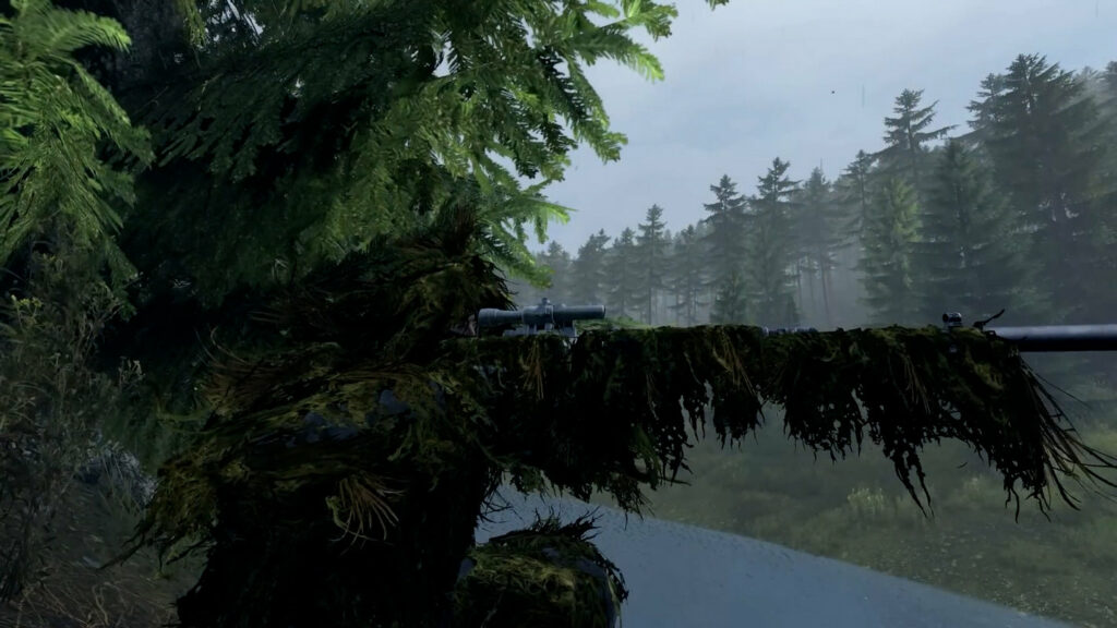 We see a sniper in a ghillie suit in the profile at the edge of a forest, looking through the scope. The sky is cloudy.